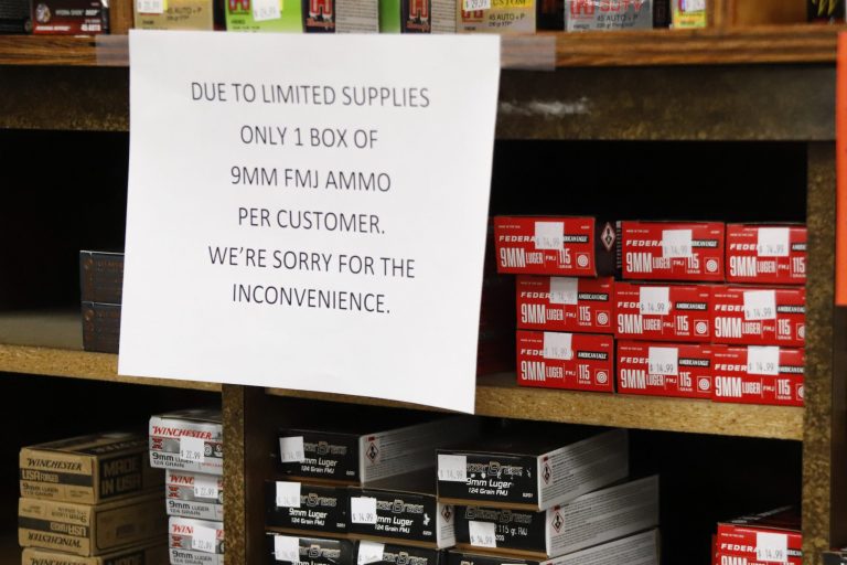 Signs point out quantity limits on certain types of ammunition after Dukes Sport Shop reopened, Wednesday, March 25, 2020, in New Castle, Pa. Ammo shortages are national.