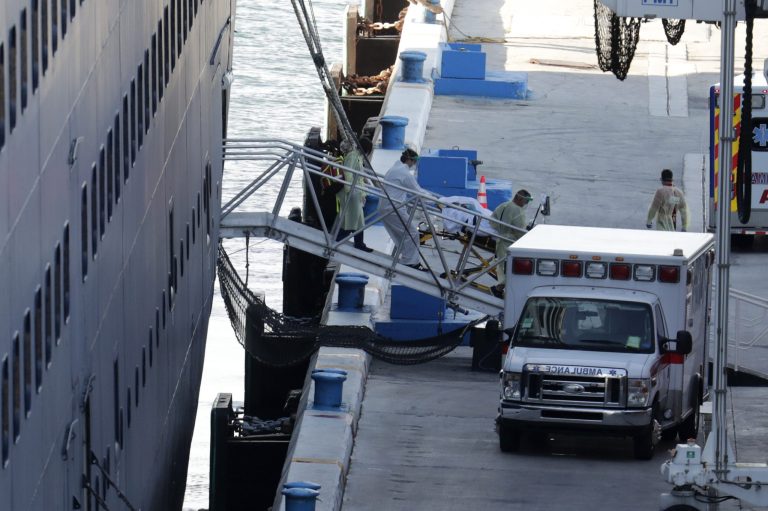 A person is removed on a stretcher from Carnival's Holland America cruise ship Zaandam at Port Everglades during the new coronavirus pandemic, Thursday, April 2, 2020, in Fort Lauderdale, Fla.