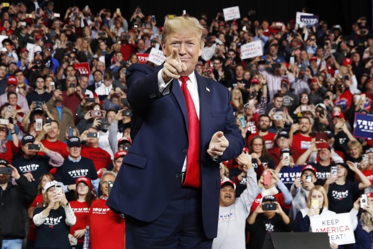 President Donald Trump points as he arrives to speak at a campaign rally, in Toledo, Ohio, in January.