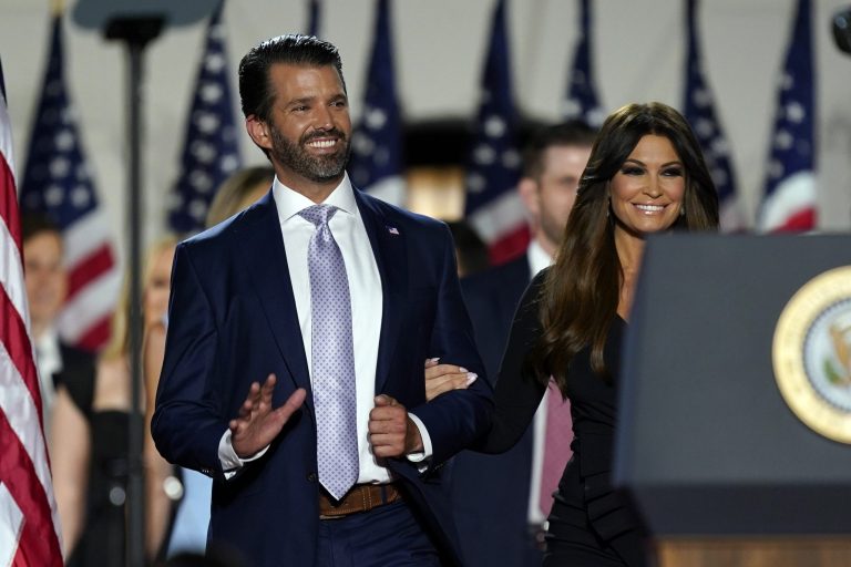 Donald Trump Jr., and his partner Kimberly Guilfoyle, chairwoman of the finance committee for the Trump Victory Committee, arrive before President Donald Trump accepts the nomination to run again during the last day of the Republican National Convention Thursday.