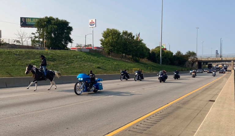 Adam Hollingsworth, the Dreadhead Cowboy, rides his horse down the local lanes of the Dan Ryan Expressway with motorcycles and motorists to support Kids Lives Matter on Monday, Sept. 21, 2020. 
