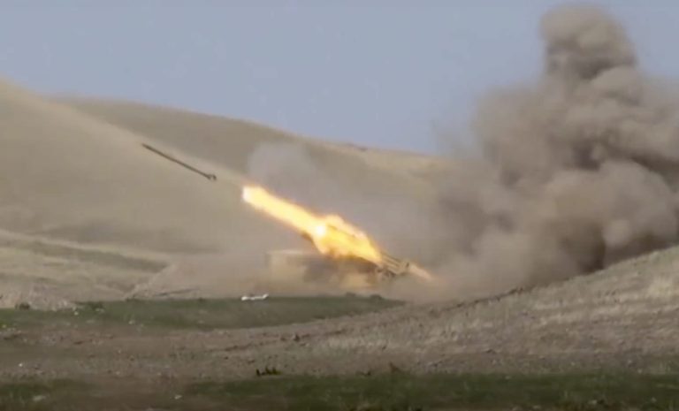 In this image taken from footage released by Azerbaijan's Defense Ministry on Sunday, Sept. 27, 2020, an Azerbaijan's rocket launches from missile system at the contact line of the self-proclaimed Republic of Nagorno-Karabakh, Azerbaijan.