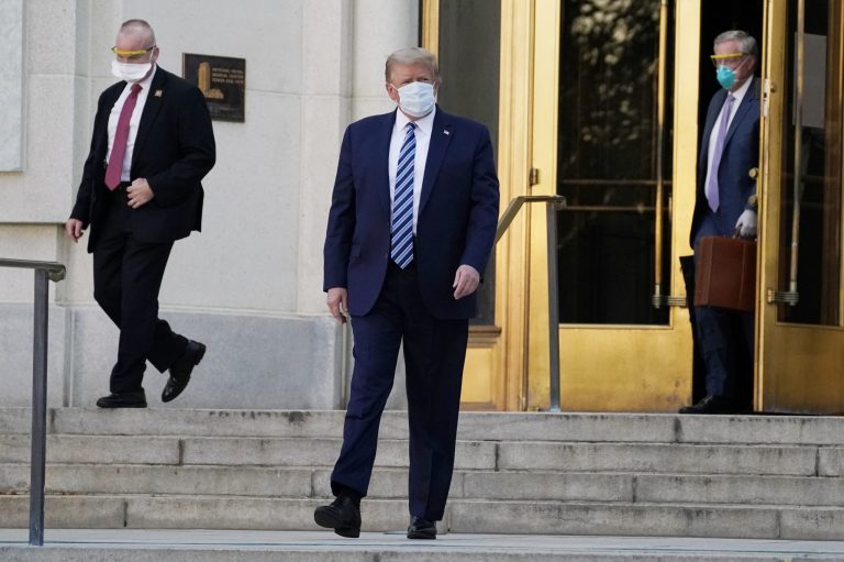 President Donald Trump walks out of Walter Reed National Military Medical Center to return to the White House after receiving treatments for covid-19, Monday, Oct. 5, 2020, in Bethesda, Md.