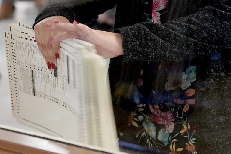 Maricopa County election officials count ballots for the general election at the Maricopa County Recorders Office, Wednesday, Nov. 4, 2020, in Phoenix.
