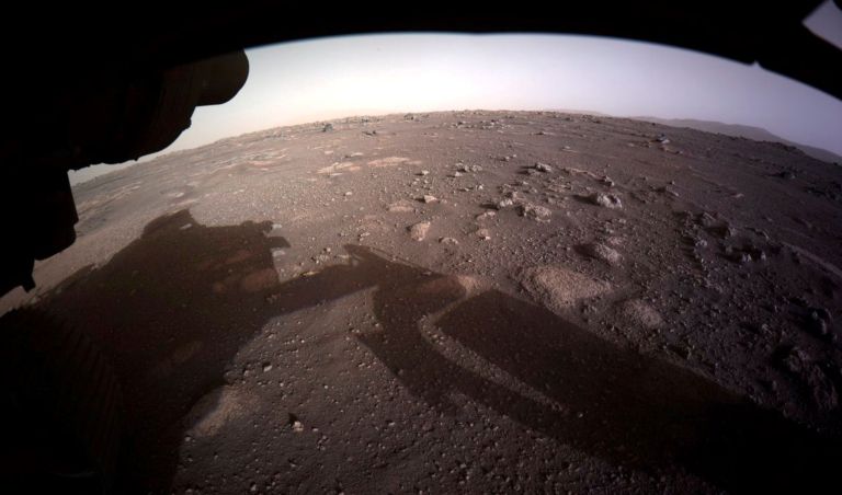 This photo provided by NASA shows the first color image sent by the Perseverance Mars rover after its landing on Thursday, Feb. 18, 2021.