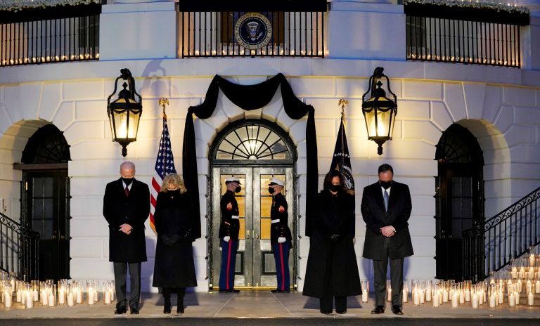 From left, President Joe Biden, First Lady Jill Biden, Vice President Kamala Harris and her husband Doug Emhoff, bow their heads during a ceremony to honor the 500,000 Americans that died from COVID-19, at the White House, Monday, Feb. 22, 2021, in Washington.