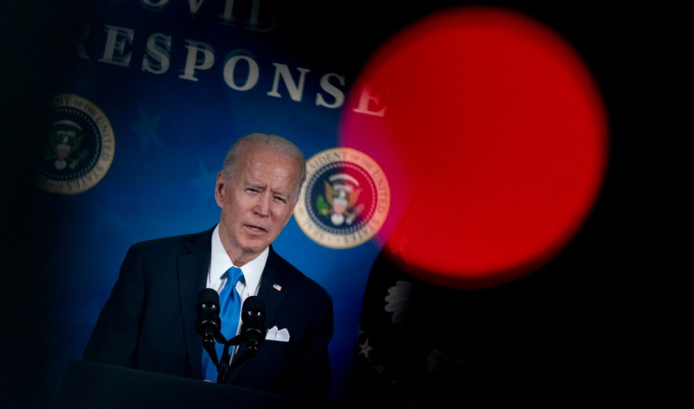 Biden takes veiled swipes at Trump during his first national address