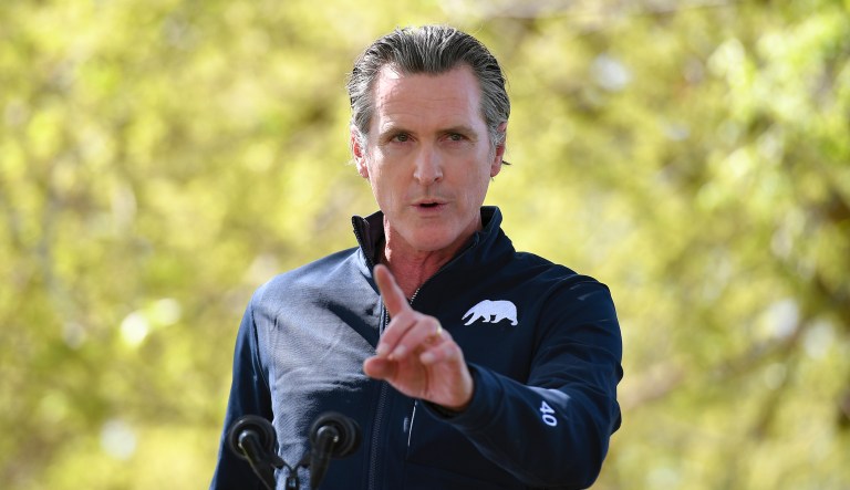 California Gov. Gavin Newsom speaks during a visit by first lady Jill Biden at The Forty Acres, the first headquarters of the United Farm Workers labor union, in Delano, Calif., Wednesday, March 31, 2021.
