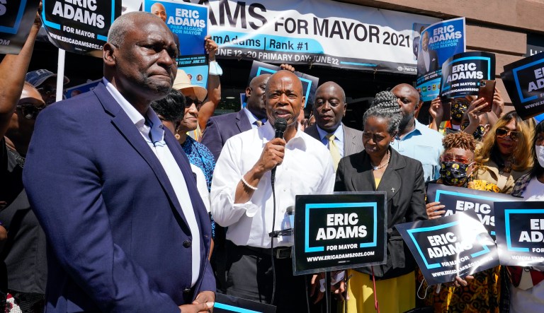 Democratic mayoral candidate Eric Adams, second from left, is joined by former New York State Assemblyman Keith Wright during a campaign event, Thursday, June 17, 2021, in the Harlem neighborhood of New York. Wright endorsed Adams.