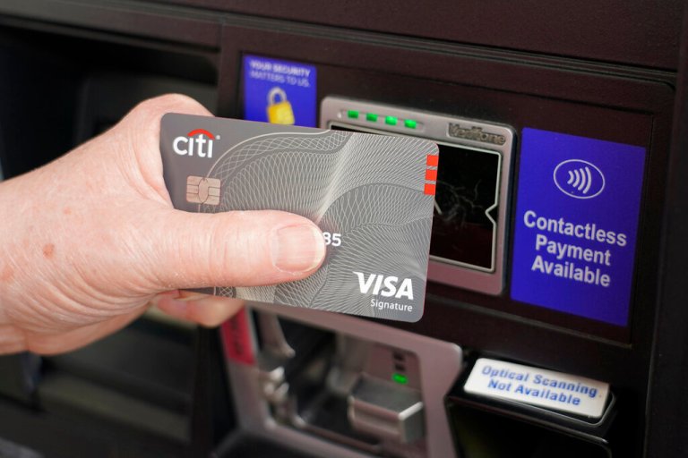 A customer uses the contactless payment chip in their Visa card to purchase gasoline at a station in Ridgeland, Miss., Thursday, July 1, 2021.