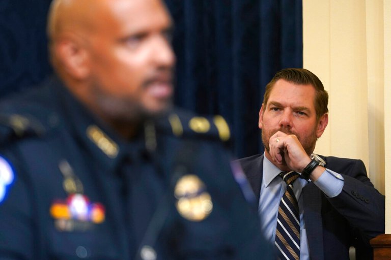 Rep. Eric Swalwell, D-Calif., stands on the side and listens as U.S. Capitol Police Sgt. Harry Dunn testifies during the House select committee hearing on the Jan. 6 attack on Capitol Hill in Washington, Tuesday, July 27, 2021.