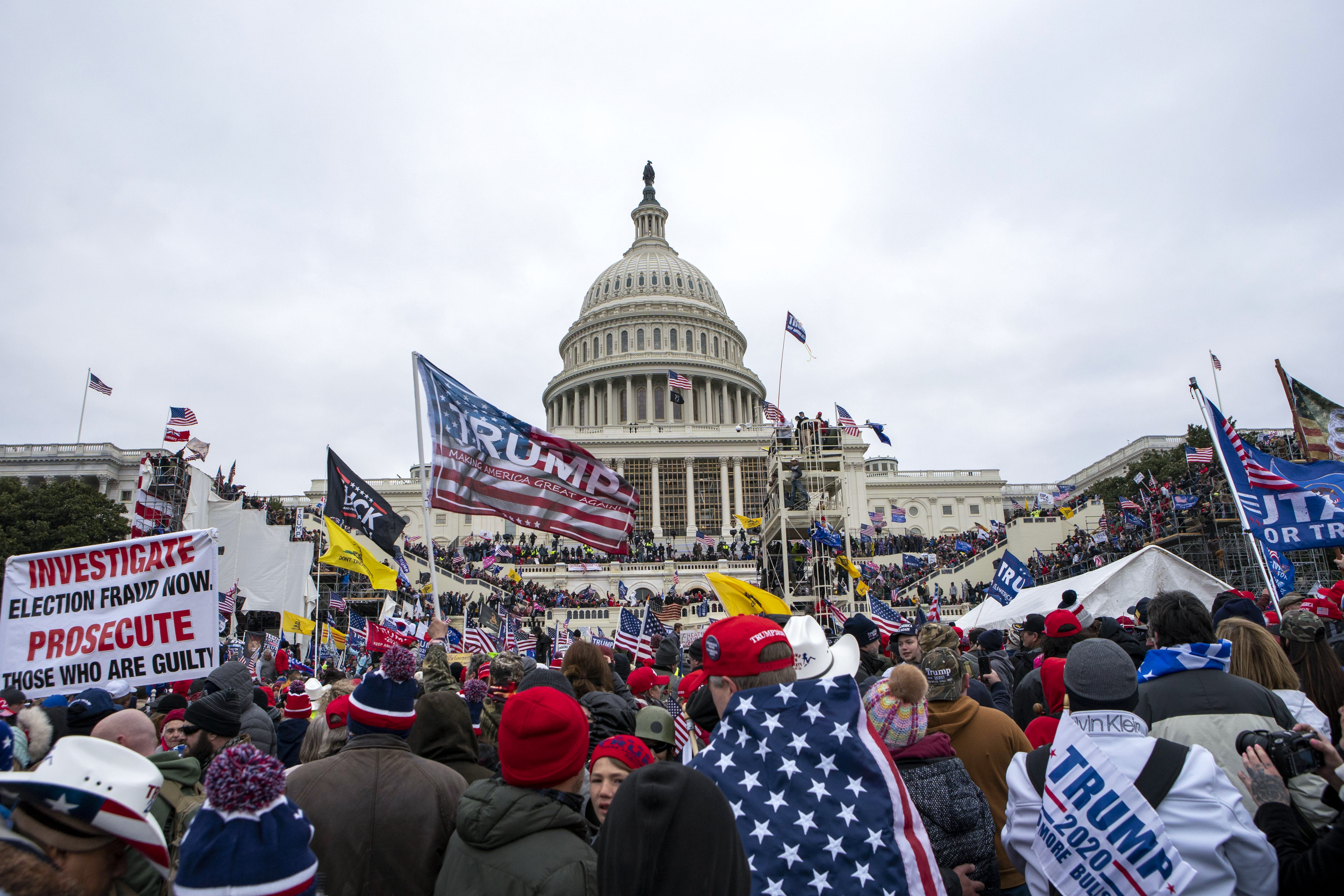 FILE - In this Jan. 6, 2021, file photo insurrections loyal to President Donald Trump rally at the U.S. Capitol in Washington. U.S. Capitol Police officers who were attacked and beaten during the Capitol riot filed a lawsuit Thursday, Aug. 26, against former President Donald Trump, his allies and members of far-right extremist groups, accusing them of intentionally sending insurrectionists to disrupt the congressional certification of the election in January.