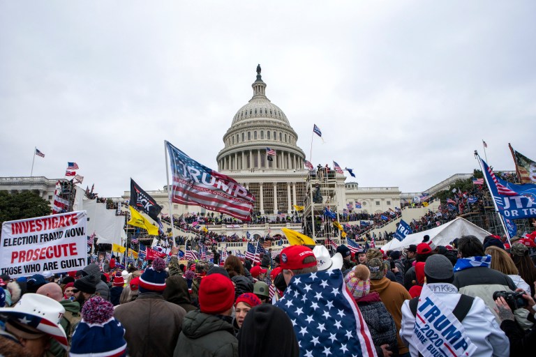 FILE - In this Jan. 6, 2021, file photo insurrections loyal to President Donald Trump rally at the U.S. Capitol in Washington. U.S. Capitol Police officers who were attacked and beaten during the Capitol riot filed a lawsuit Thursday, Aug. 26, against former President Donald Trump, his allies and members of far-right extremist groups, accusing them of intentionally sending insurrectionists to disrupt the congressional certification of the election in January. 