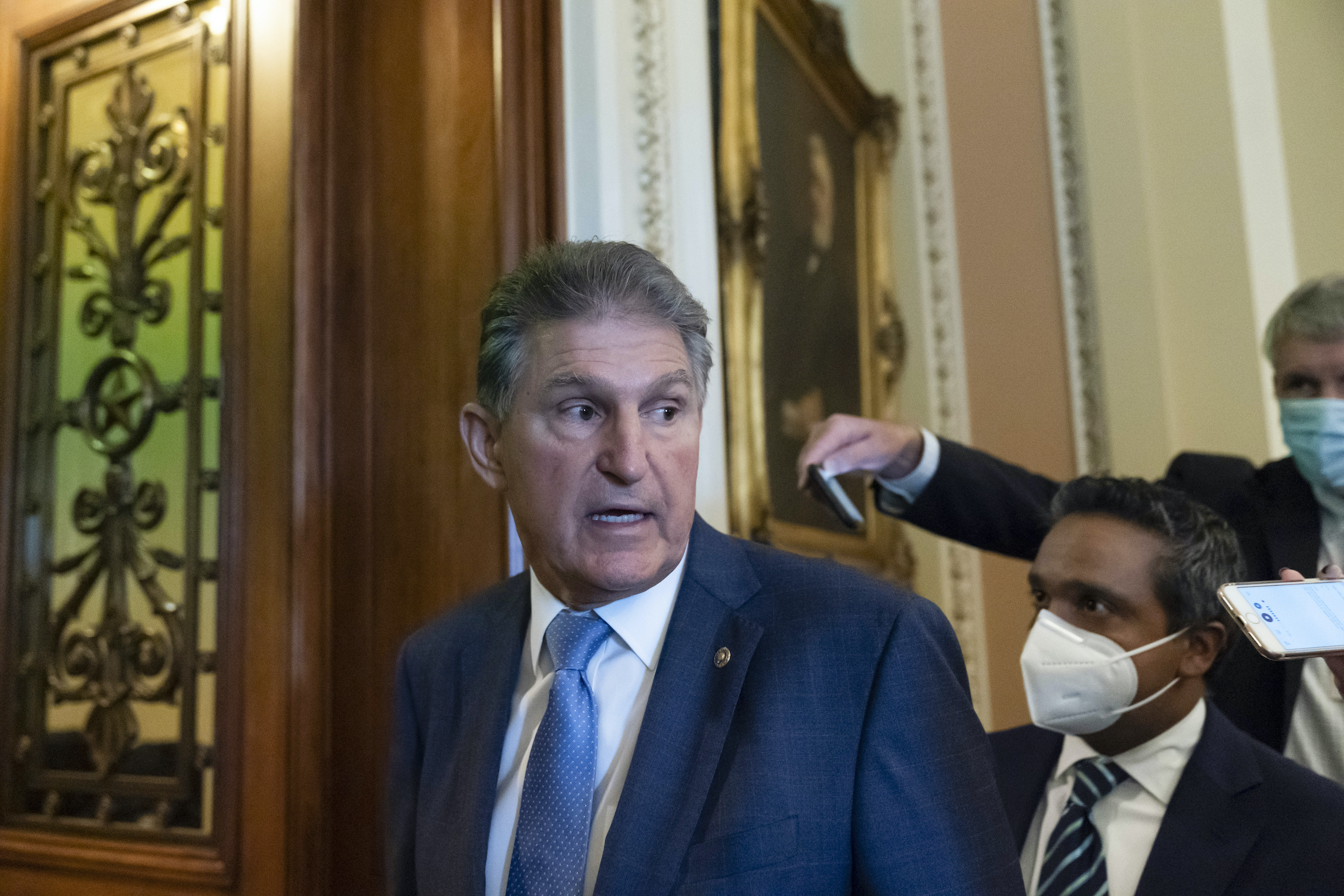 Manchin huddles with progressives over spending bill divide: ‘We’re talking’