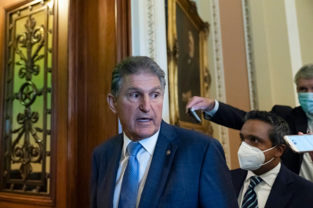 Manchin huddles with progressives over spending bill divide: ‘We’re talking’