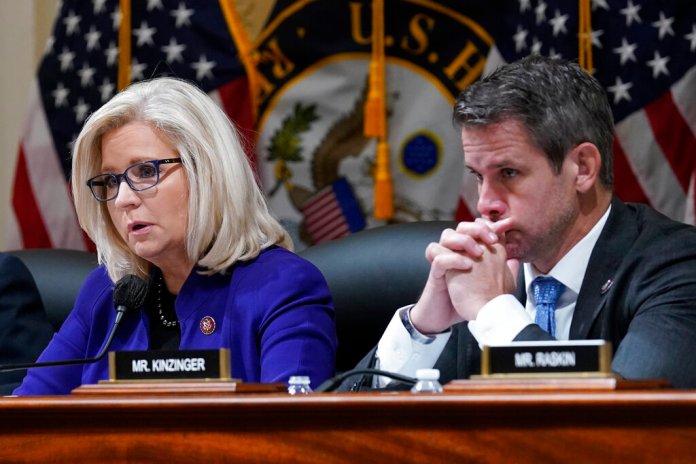 Rep. Liz Cheney and Rep. Adam Kinzinger listen as the House select committee tasked with investigating the Jan. 6 attack on the U.S. Capitol meets to hold Steve Bannon, one of former President Donald Trump's allies, in contempt, on Capitol Hill in Washington, Tuesday, Oct. 19, 2021.