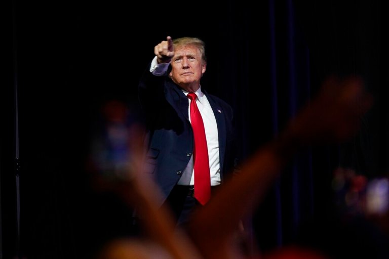 In this July 24, 2021, file photo, former President Donald Trump points to supporters after speaking at a Turning Point Action gathering, in Phoenix.