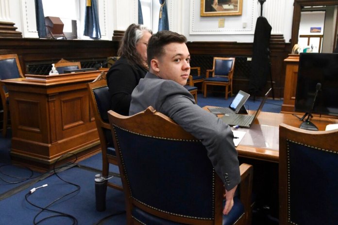 Kyle Rittenhouse waits for the start of his trial at the Kenosha County Courthouse in Kenosha, Wisconsin.