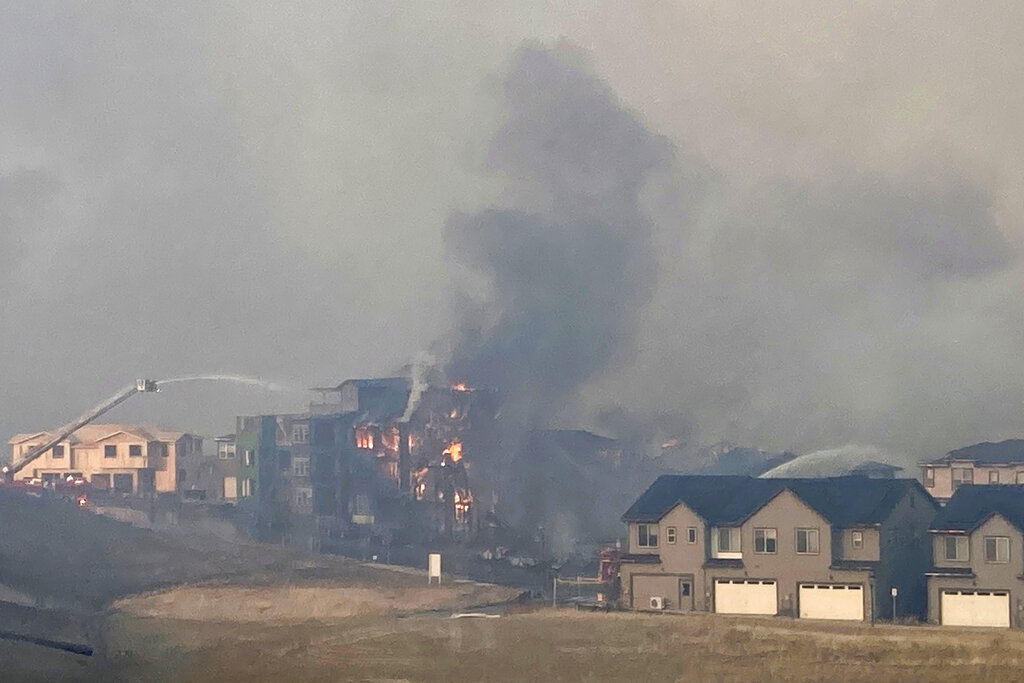 More than 500 homes burned down by Colorado fires as winter storm approaches