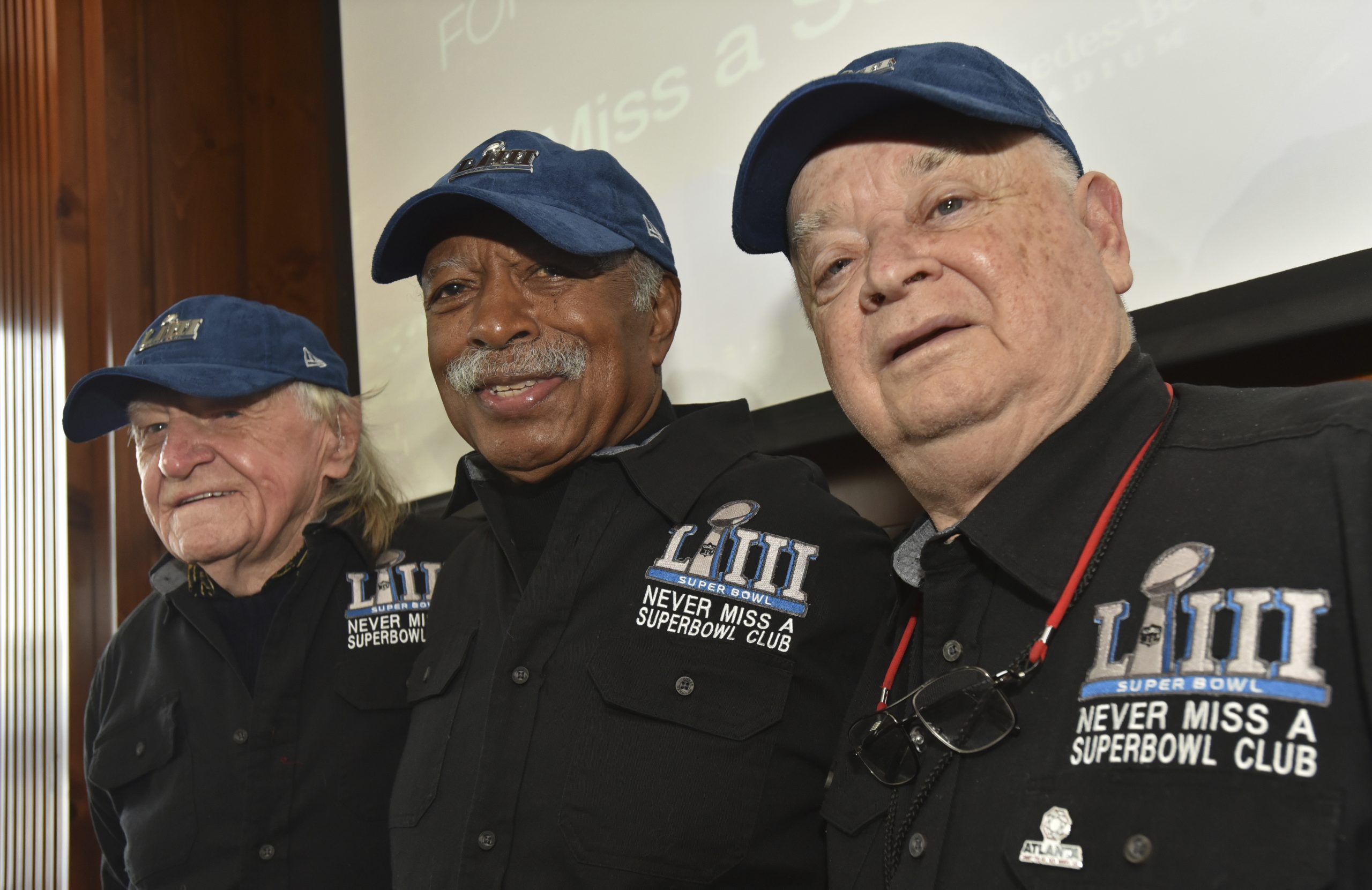 Members of the Never Miss a Super Bowl Club (from the left, Tom Henschel, Gregory Eaton, and Don Crisman) pose for a group photograph during a welcome luncheon in Atlanta on Feb. 1, 2019. The three men have attended every game since the first AFL-NFL World Championship held 55 years ago. They're meeting at the Super Bowl once again for this year's game, but future meetings are in question.
