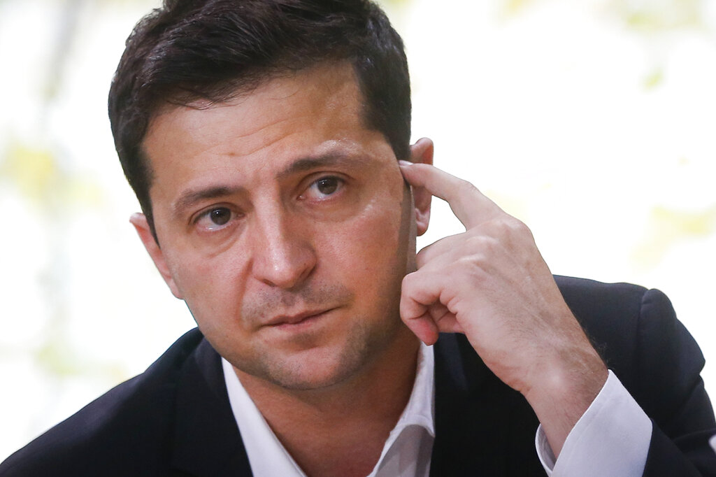 Zelensky answers Putin’s rally with warning, plea for peace