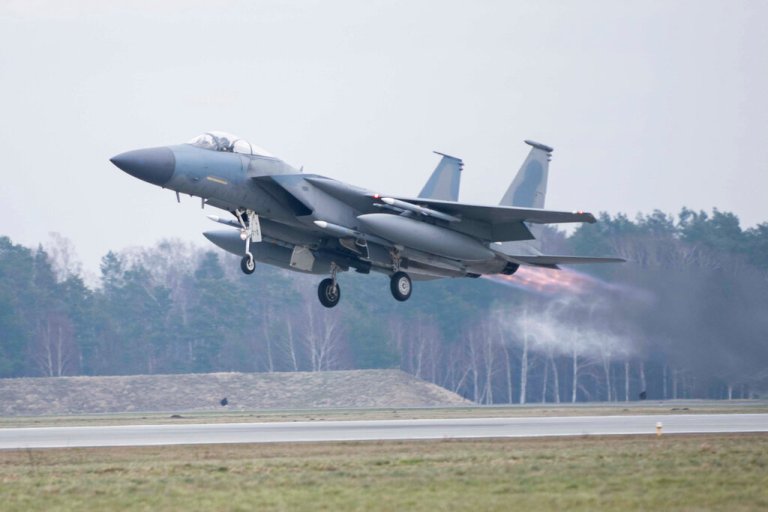 In this image provided by the U.S. Air Force, a U.S. Air Force F-15C Eagle assigned to the 493rd Fighter Squadron, Royal Air Force Lakenheath, takes off in support of North Atlantic Treaty Organization enhanced air policing missions with the Polish Air Force at Lask Air Base, Poland, Feb. 15, 2022.
