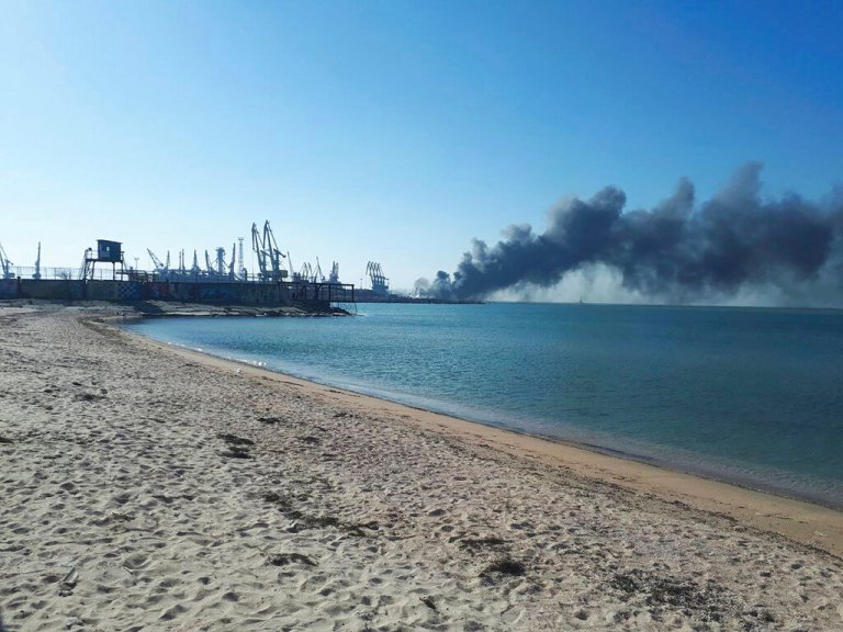 Smoke rises after shelling near a seaport in Berdyansk, Ukraine, Thursday, March 24, 2022. Ukraine's navy reported Thursday that it had sunk the Russian ship Orsk in the Sea of Asov near the port city of Berdyansk. (AP Photo)