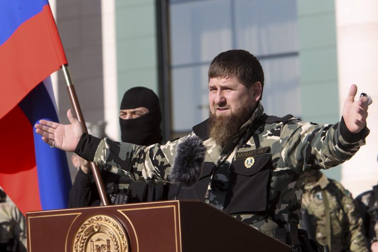 Ramzan Kadyrov, leader of the Russian province of Chechnya, gestures to about 10,000 troops in Chechnya's regional capital of Grozny, Russia, Tuesday, March 29, 2022.