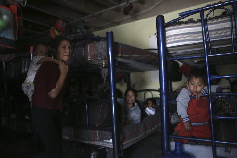 FILE - Migrants rest in a dormitory of the Good Samaritan shelter in Juarez, Mexico, March 29, 2022. 