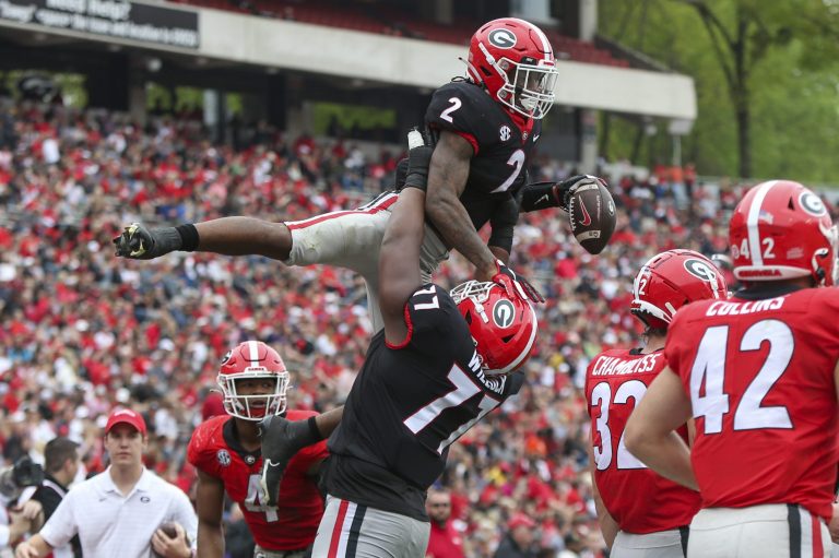 University of Georgia football player and staff member killed in car crash