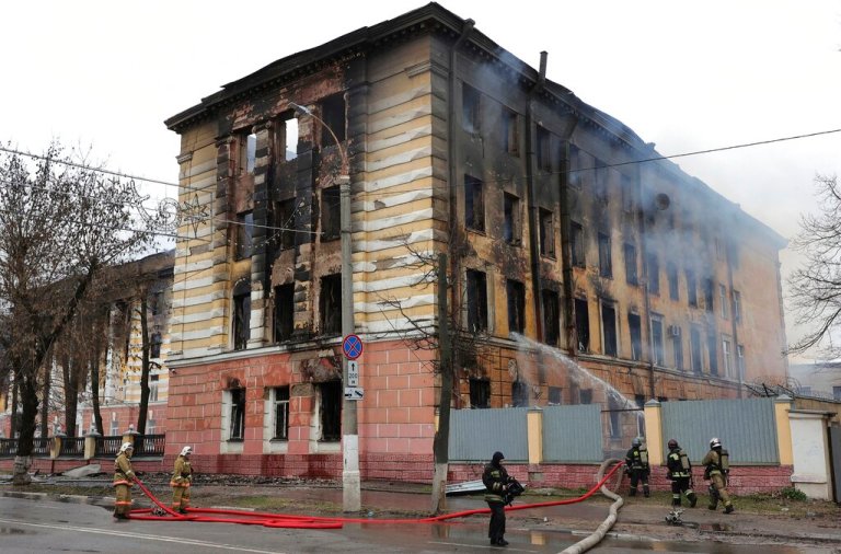 Firefighters hose down the burning building of the Central Research Institute of the Aerospace Defense Forces in the Russian city of Tver, Russia, Thursday, April 21, 2022.