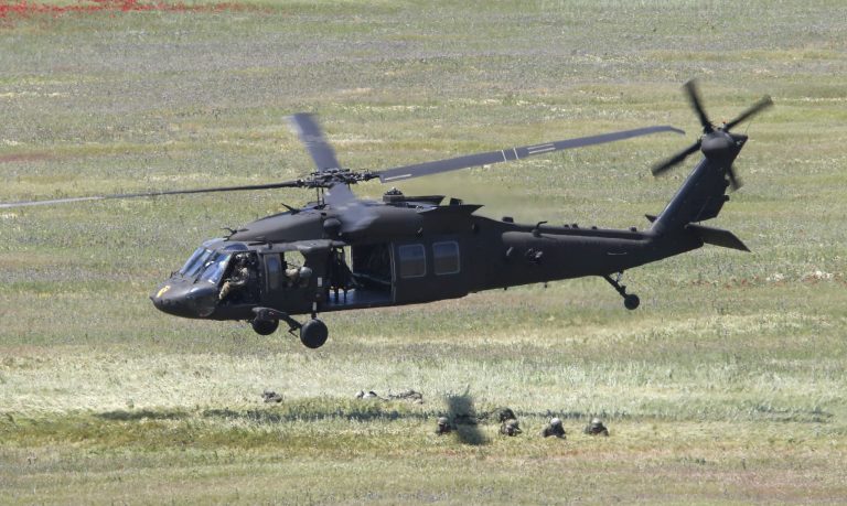 A U.S. Black Hawk helicopter takes off after deploying soldiers during the Swift Response 22 military exercise at the Krivolak army training polygon in the central part of North Macedonia, on Thursday, May 12, 2022. 