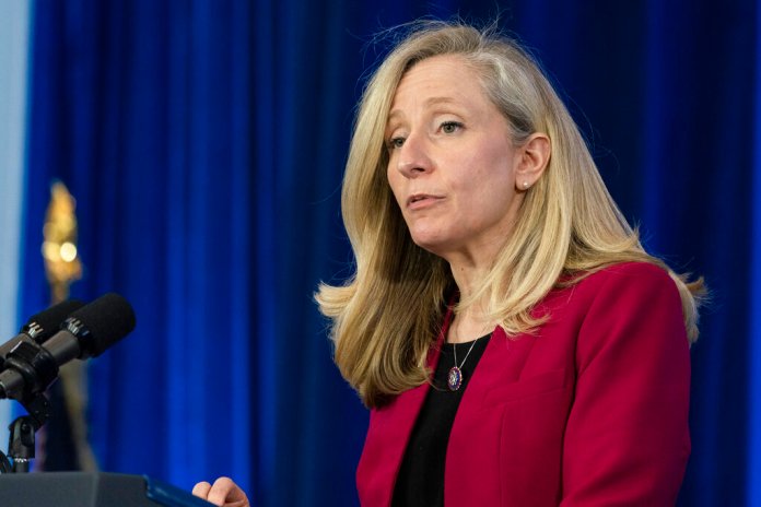 FILE - Rep. Abigail Spanberger, D-Va., speaks before President Joe Biden talks about prescription drug costs at the Daniel Technology Center of Germanna Community College â Culpeper Campus, Feb. 10, 2022, in Culpeper, Va. Crowded Republican congressional primaries in Virginiaâs 2nd and 7th districts, on Tuesday, June 21, 2022, will settle who takes on centrist Democrats Elaine Luria and Spanberger in Novemberâs general elections, which in turn could help determine which party controls the U.S. House.