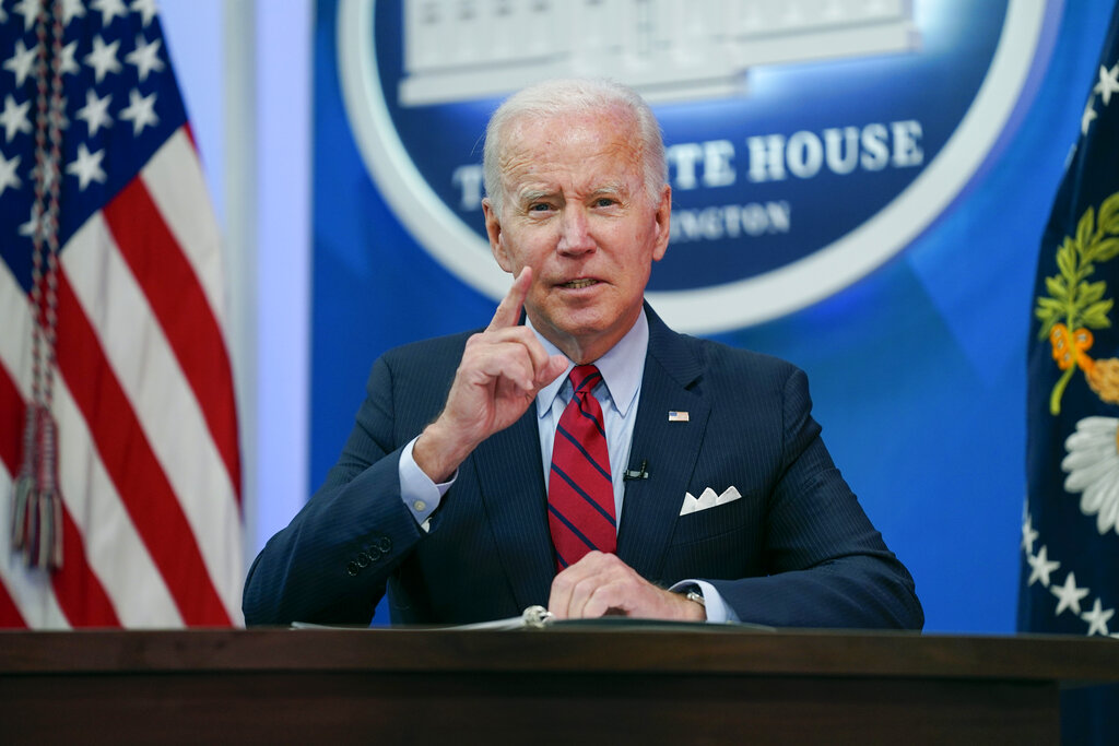 As inflation roars, Biden keeps defending spending
