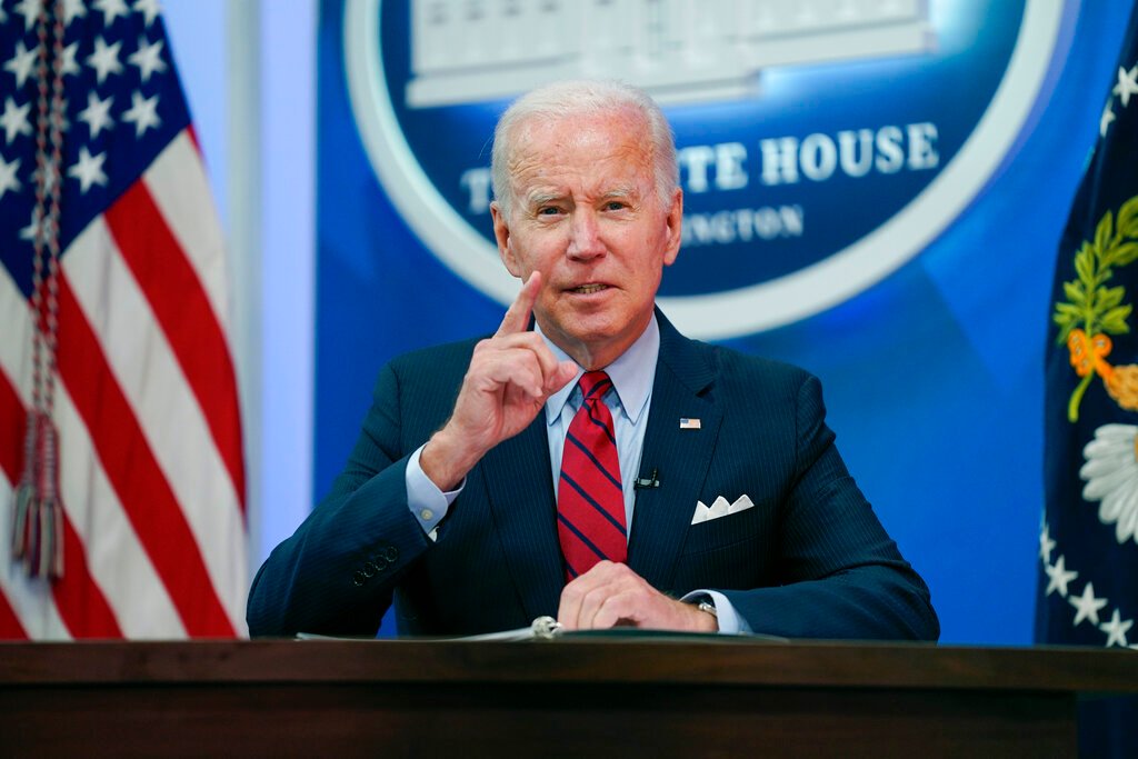 As inflation roars, Biden keeps defending spending