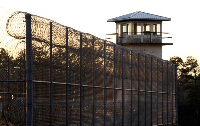 The sun sets behind Holman Prison in Atmore, Ala., on Jan. 27, 2022. The execution of Joe Nathan James Jr, which took place on July 28, has raised questions over how long it took to carry out.