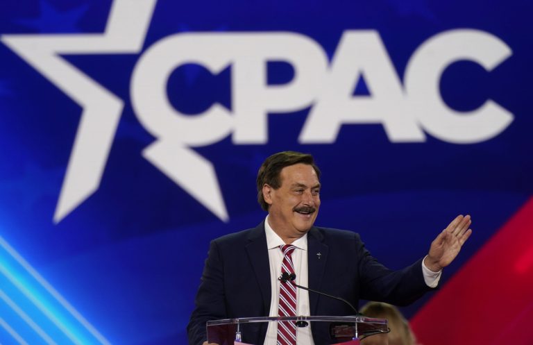 My Pillow CEO Mike Lindell waves before speaking at the Conservative Political Action Conference (CPAC) in Dallas, Friday, Aug. 5, 2022. Lindell warned in his speech that 