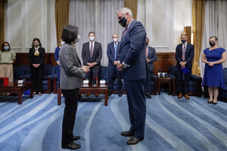 In this photo released by the Taiwan Presidential Office, Taiwan's President Tsai Ing-wen, left, meets U.S. Indiana Governor Eric Holcomb at the Presidential office in Taipei, Taiwan, Monday, Aug 22, 2022. Holcomb met with Tsai Monday morning, following two recent high-profile visits by U.S. politicians that drew China's ire and Chinese military drills that included firing missiles over the island.
