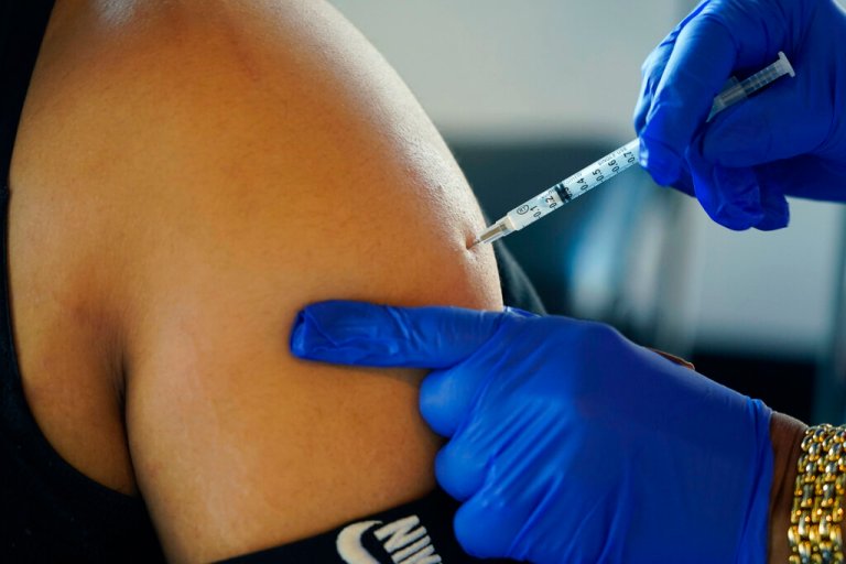A Jackson, Miss., resident receives a Pfizer booster shot from a nurse at a vaccination site Tuesday, Feb. 8, 2022. In August 2022, Pfizer and Moderna both asked U.S. regulators to authorize modified versions of their booster vaccine â shots that are half the original recipe and half protection against BA.4 and BA.5, the newest subtypes of the coronavirus omicron variant. 