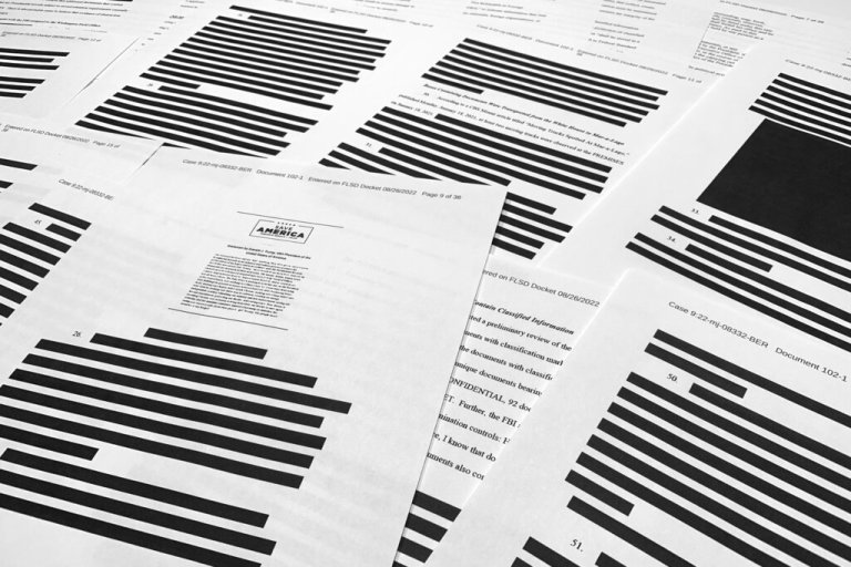 Pages from the affidavit by the FBI in support of obtaining a search warrant for former President Donald Trump's Mar-a-Lago estate are photographed Friday.