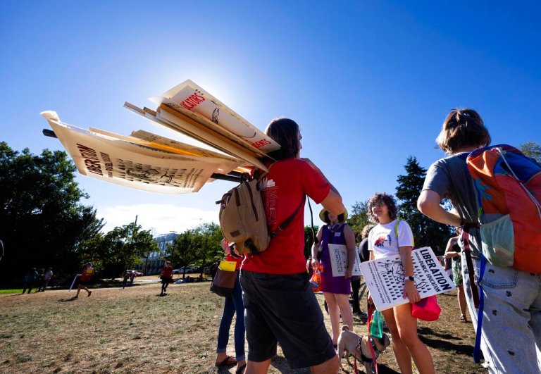 Seattle teachers hold signs in advance of a possible strike this week.