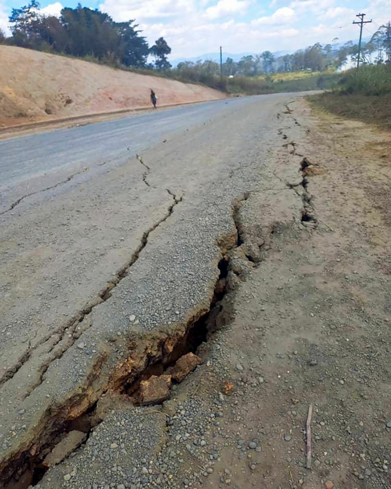 Debris lies strewn across a highway following a landslide near the town of Kainantu in Papua New Guinea.