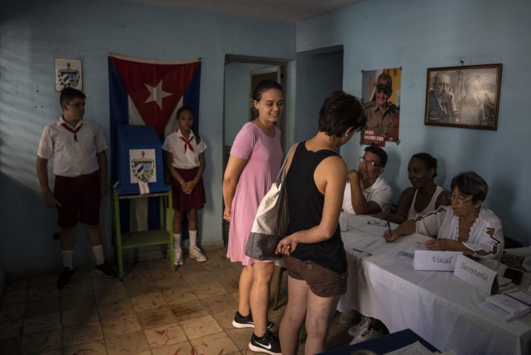 Two women register to vote at a polling station during the new Family Code referendum in Havana, Cuba.