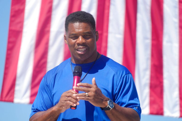Georgia GOP Senate nominee Herschel Walker smiles during remarks during a campaign stop at Battle Lumber Co. on Thursday, Oct. 6, 2022, in Wadley, Ga. 