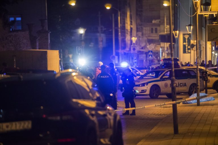 A view of the body of a victim on the ground at the scene of a shooting on Zamocka Street in Bratislava, Slovakia, Wednesday, Oct. 12, 2022. Slovakiaâs police say they found the body of a suspect who allegedly fatally shot two people the previous day in the capital in what some officials are suggesting was a hate crime. Two men were killed and a woman was wounded on Wednesday evening near or at a bar which is a popular spot for the local LGBT community in downtown Bratislava. (Jaroslav Novak/TASR via AP)