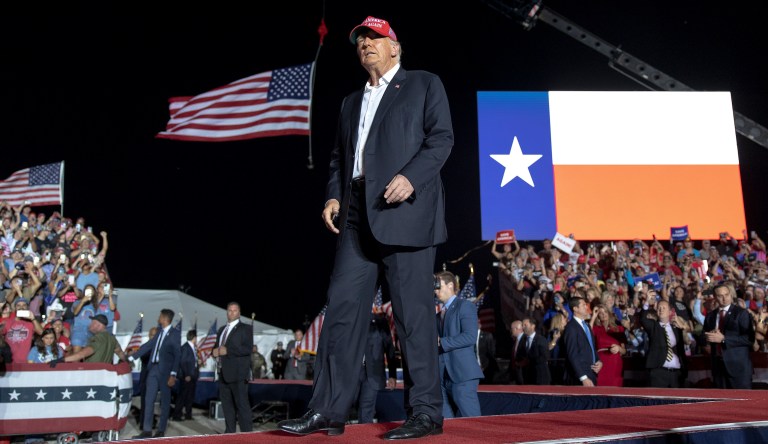Former President Donald Trump walks on stage at a rally, Saturday, Oct. 22, 2022, in Robstown, Texas. 