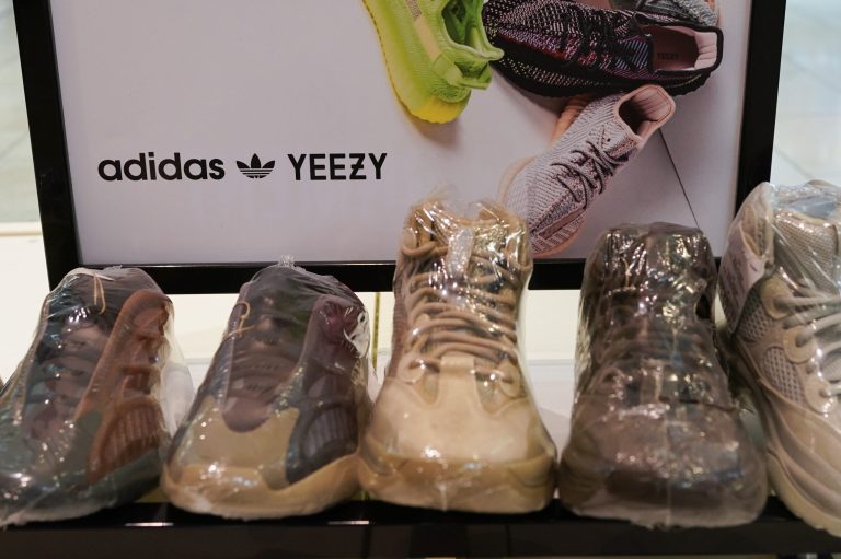 A sign advertises Yeezy shoes made by Adidas at Kickclusive, a sneaker resale store, in Paramus, N.J., Tuesday, Oct. 25, 2022.
