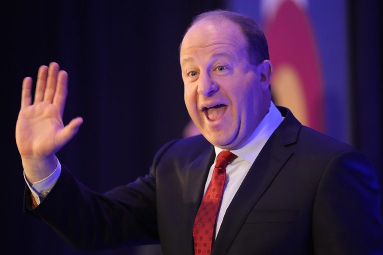Incumbent Democratic Gov. Jared Polis speaks during an election watch party Tuesday, Nov. 8, 2022, in downtown Denver.