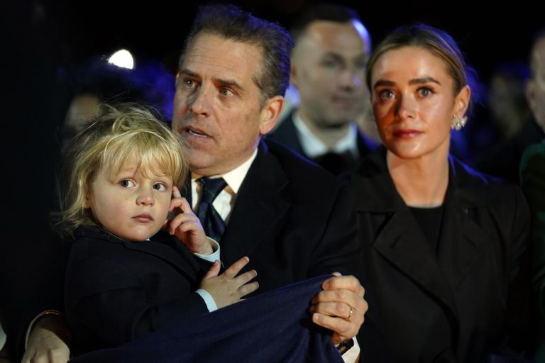 Hunter Biden, holding son Beau, and President Joe Biden's granddaughter Naomi Biden.