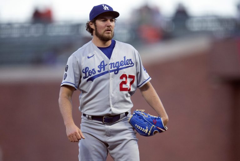 FILE - Los Angeles Dodgers starting pitcher Trevor Bauer pauses while working against the San Francisco Giants during the fourth inning of a baseball game May 21, 2021, in San Francisco.